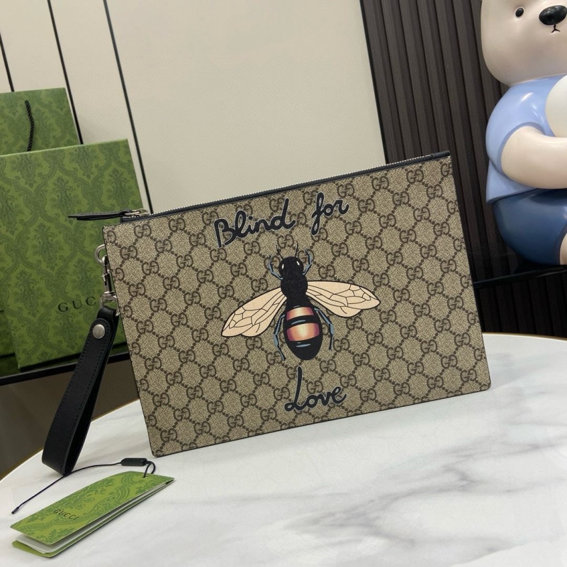 G*u*i clutch bags
